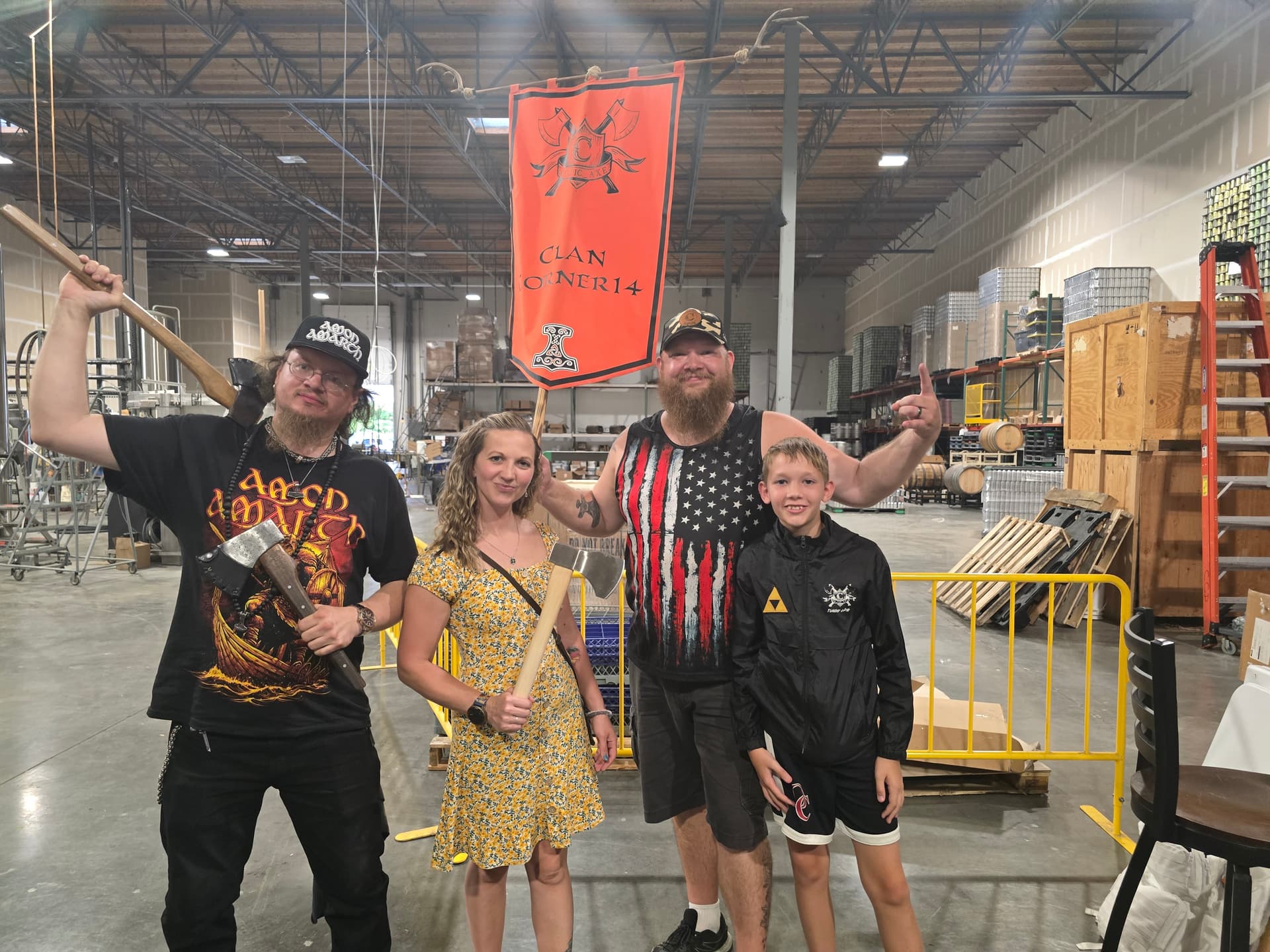 Clan O-NER14 family group with banner at brewery