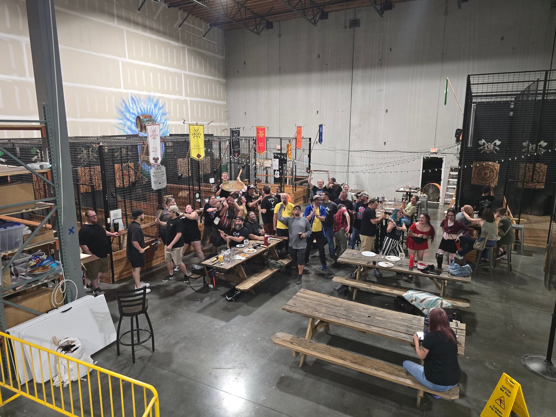 Celtic Axe tournament crowd with clan banners and throwing lanes