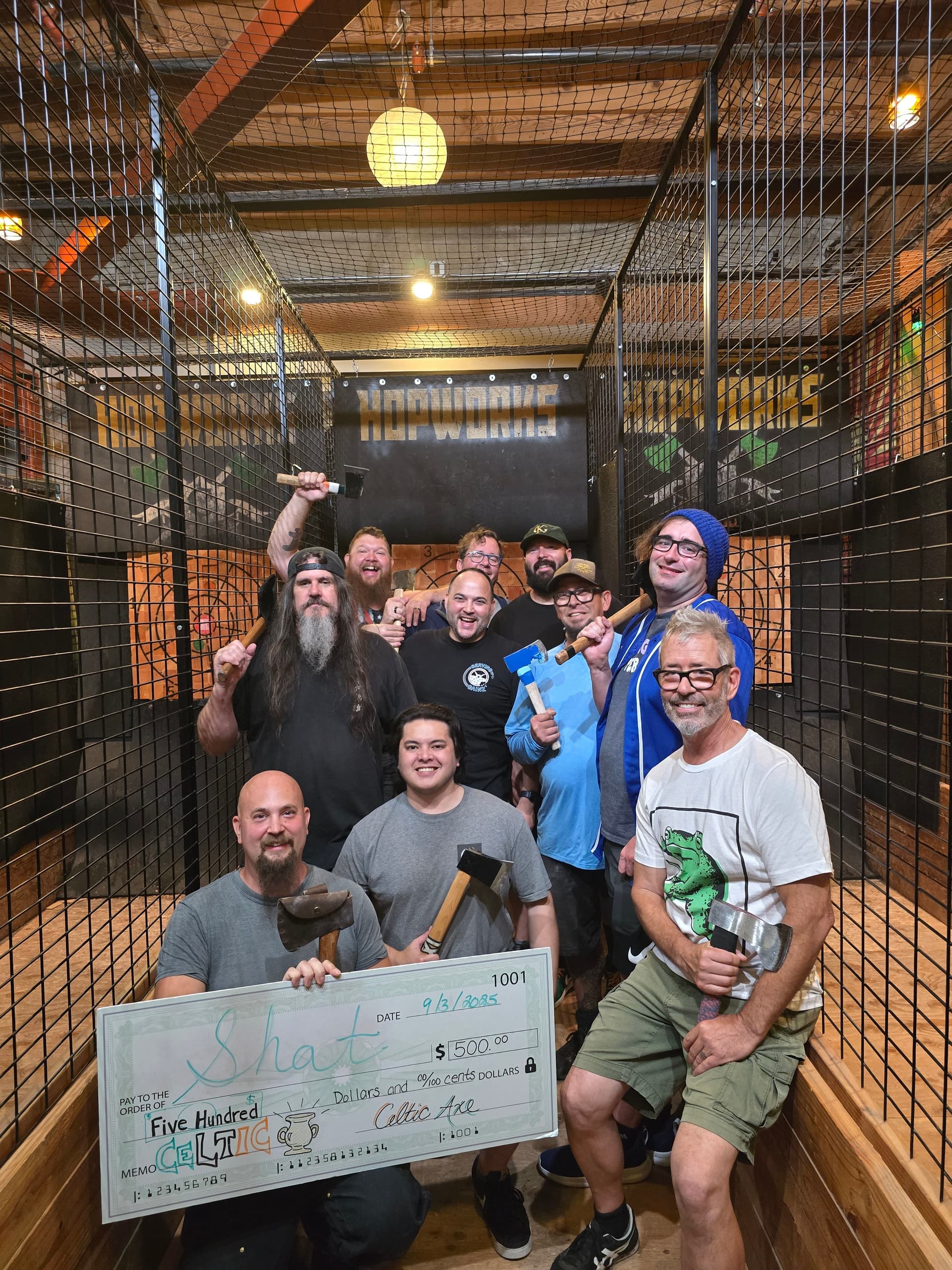 Group celebrating with $500 Celtic Cup check at Hopworks