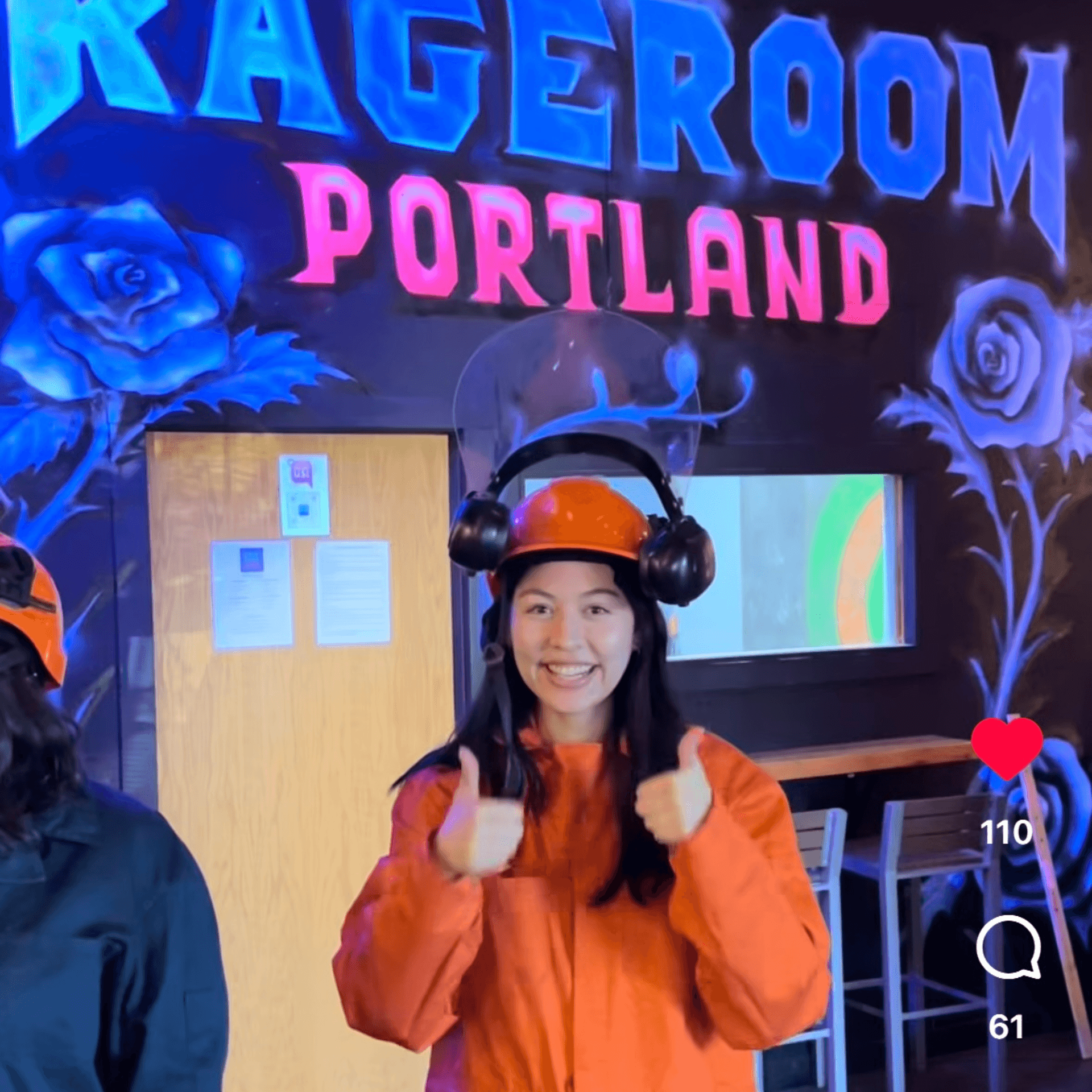 Rage Room Portland St Johns - Fun Things to Do in Portland Rage Room Portland St Johns - happy customer giving thumbs up in front of neon rage room sign