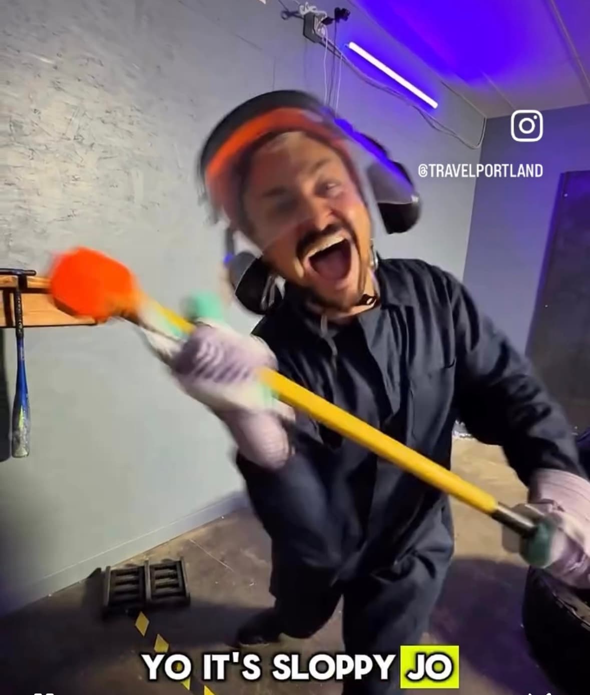Portland Smash Room - Stress Relief Activity Featured by Travel Portland Portland smash room featured by Travel Portland - man swinging sledgehammer at rage room experience